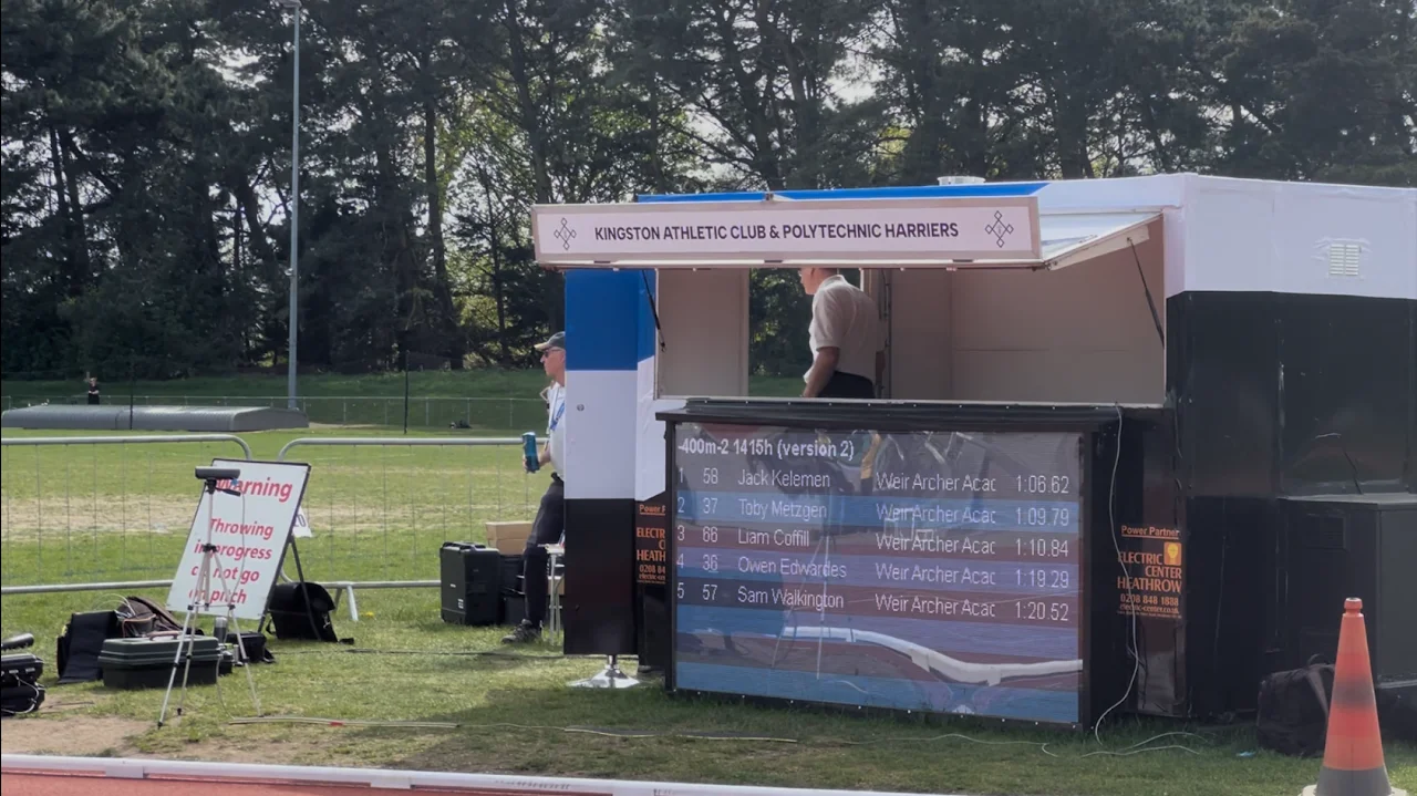 KACPH gazebo at a track meeting with a large outdoor screen beside it